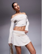 fine knit fold over  top and low waist fold over mini skirt co-ord in beige